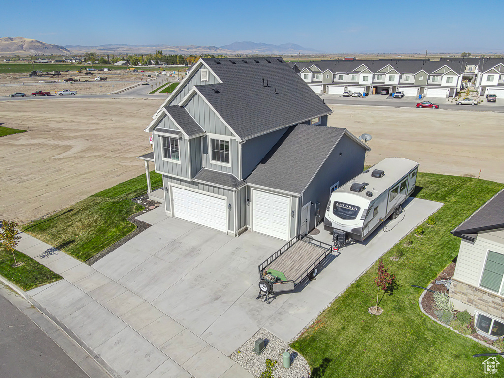 Aerial view of residential area featuring mountains