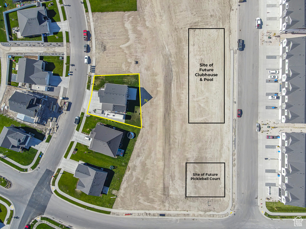 Aerial perspective of suburban area featuring property boundaries highlighted