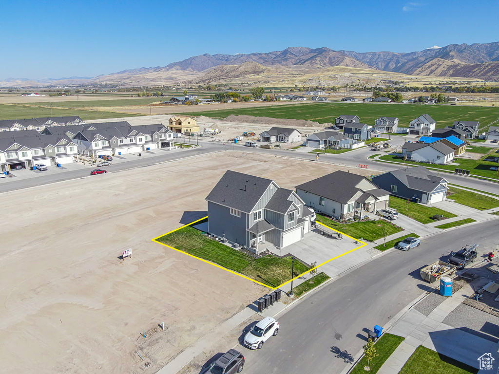Aerial view of residential area featuring mountains