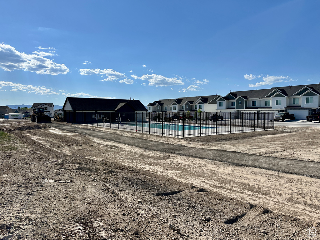 Community pool featuring a residential view