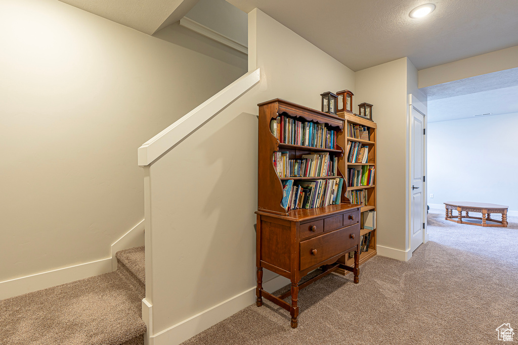 Staircase featuring carpet, baseboards, and recessed lighting