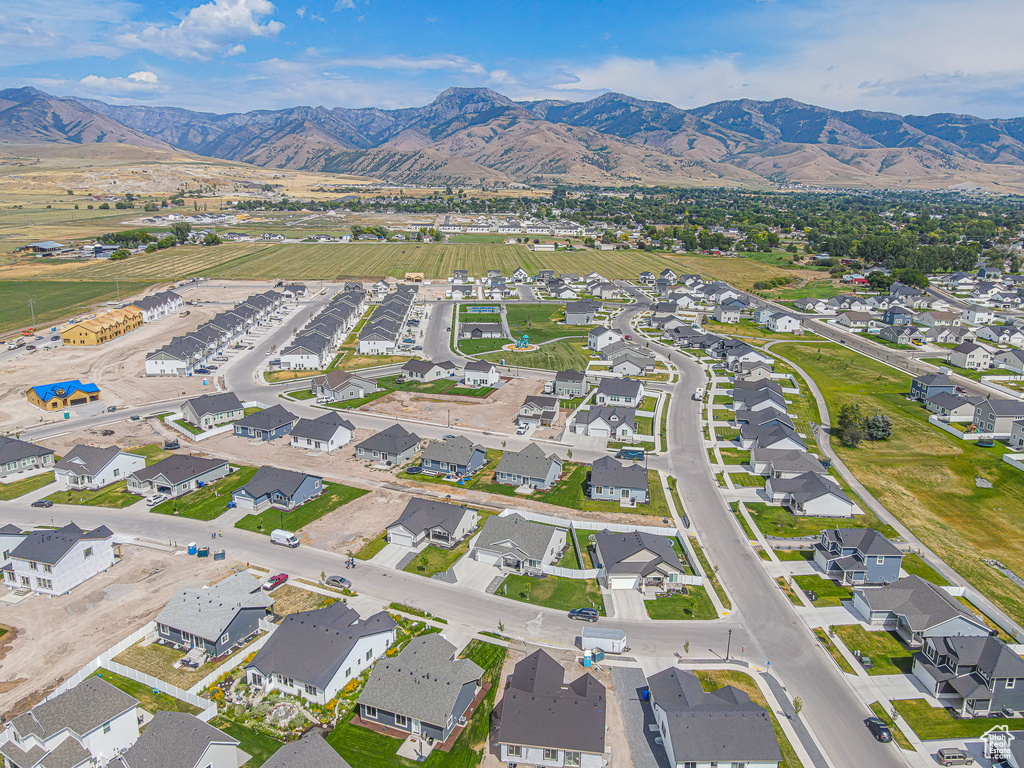 Aerial view of property\\\'s location with a mountainous background and nearby suburban area