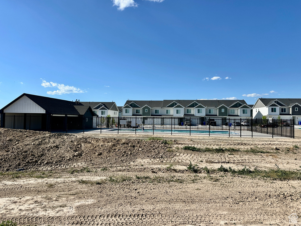 View of home's community featuring a residential view and a swimming pool