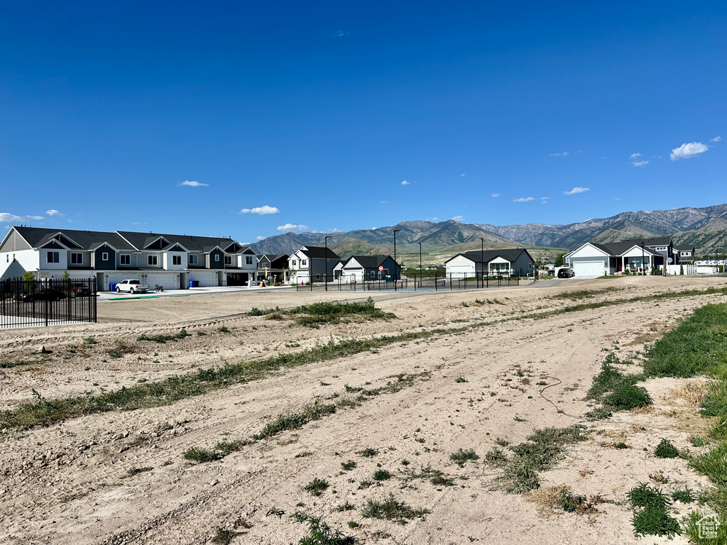 View of mountain background featuring nearby suburban area