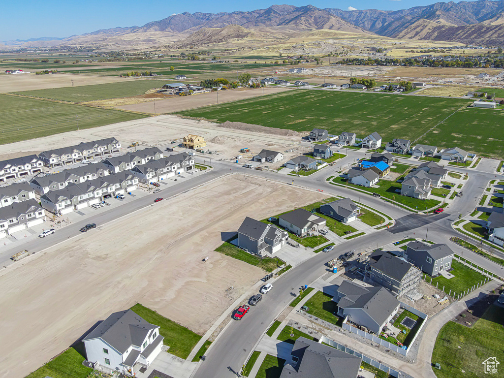 Aerial view of property\'s location with a mountainous background and nearby suburban area