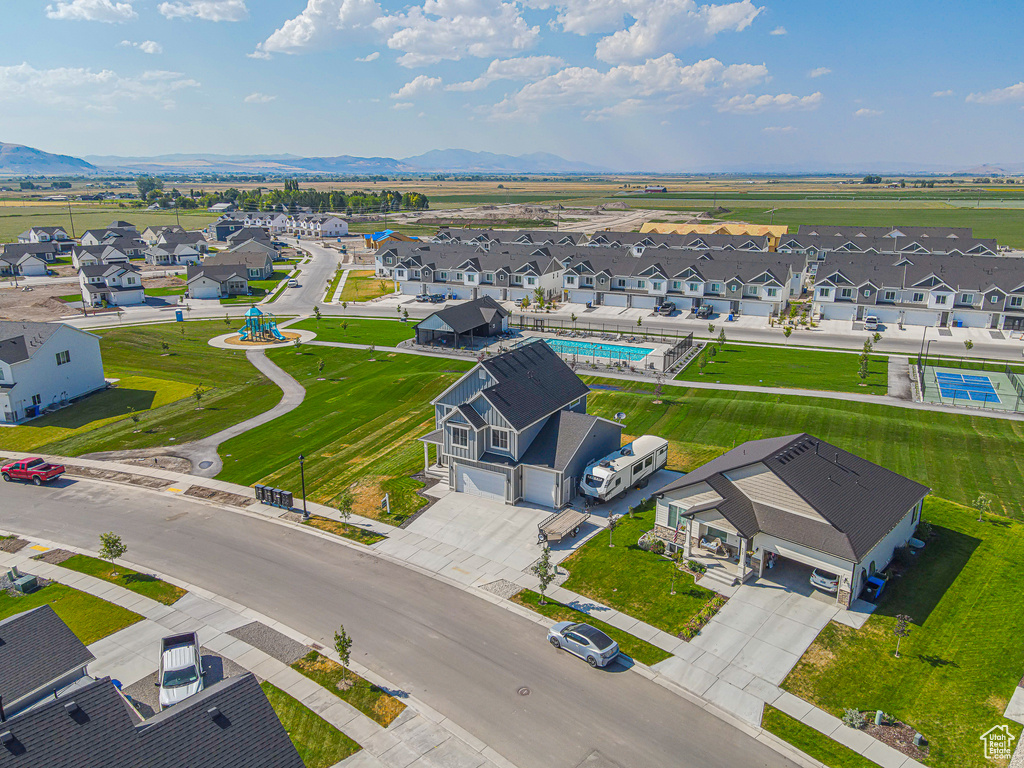 Aerial perspective of suburban area with a mountainous background