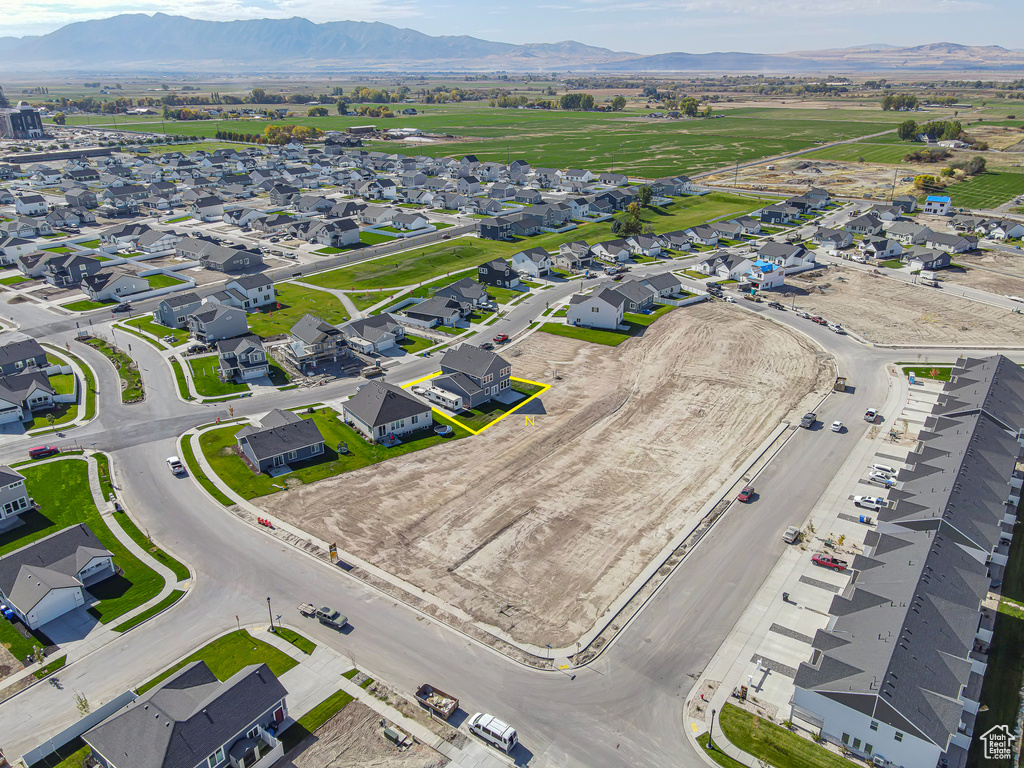Aerial view of residential area featuring a mountainous background