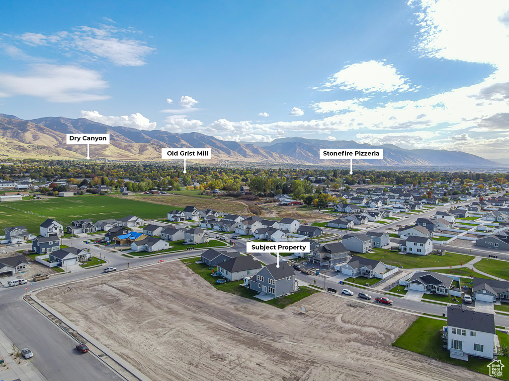 Aerial view of residential area featuring a mountain backdrop