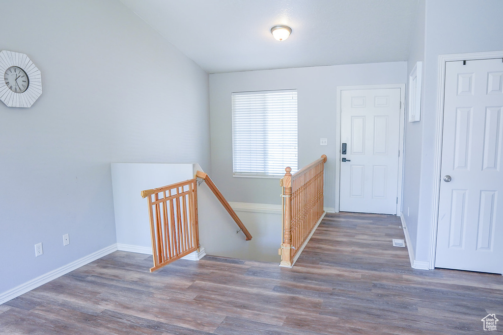 Entryway with wood finished floors and baseboards