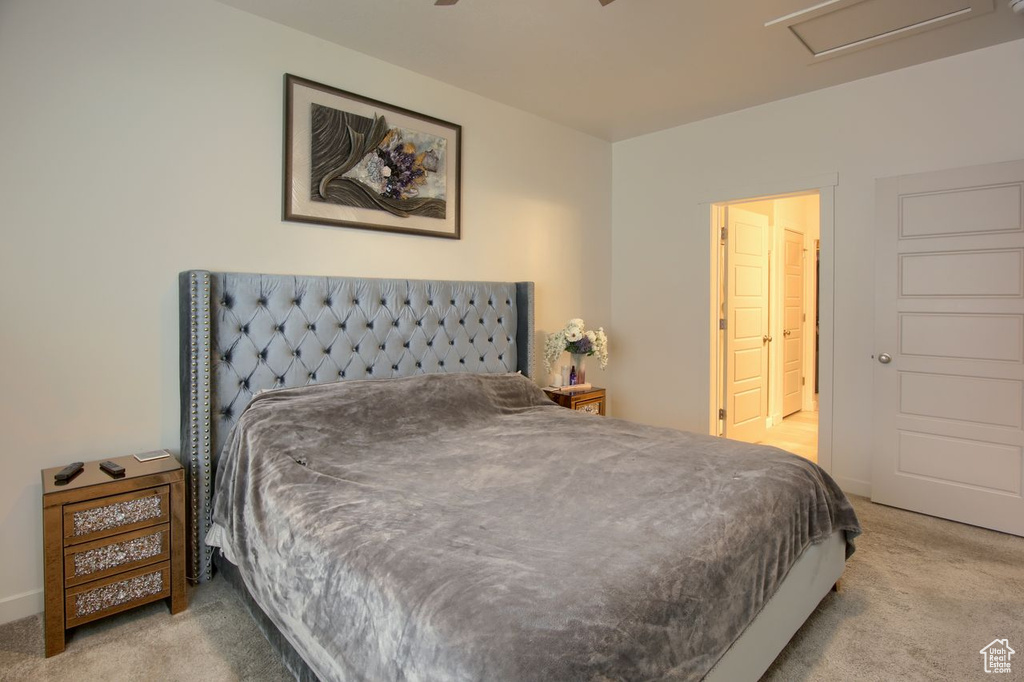 Carpeted bedroom with attic access