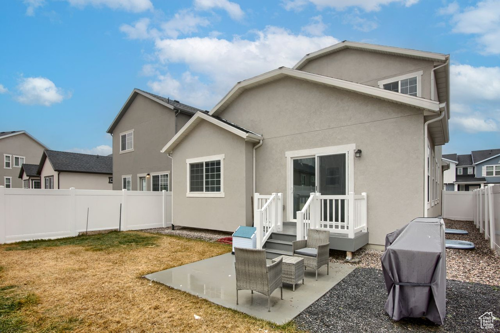 Back of house featuring a patio and stucco siding