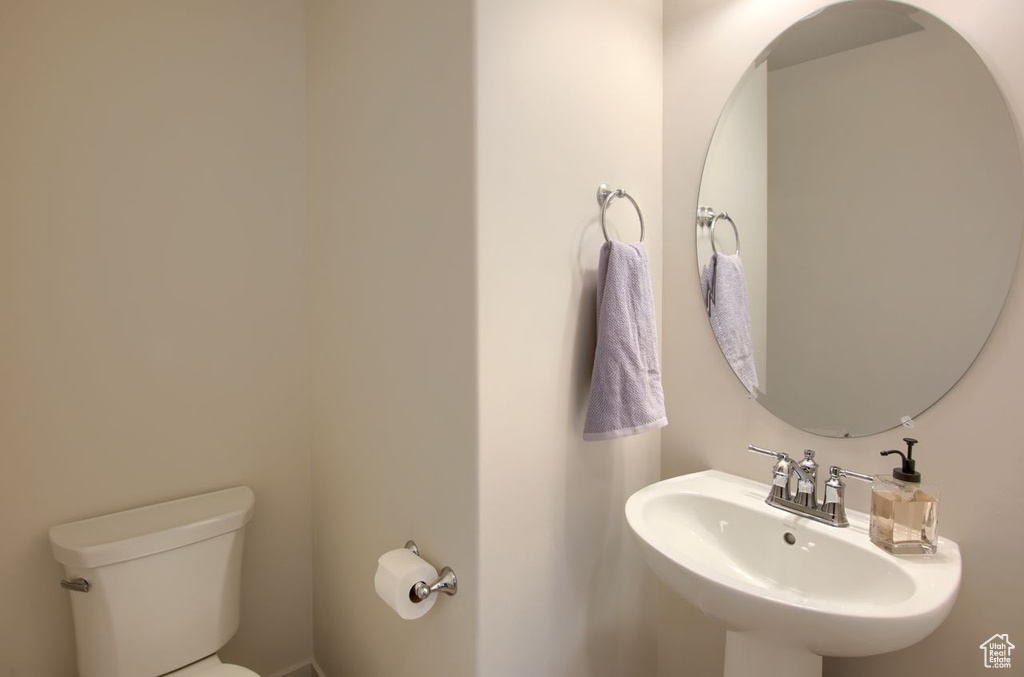 Bathroom featuring a sink and toilet