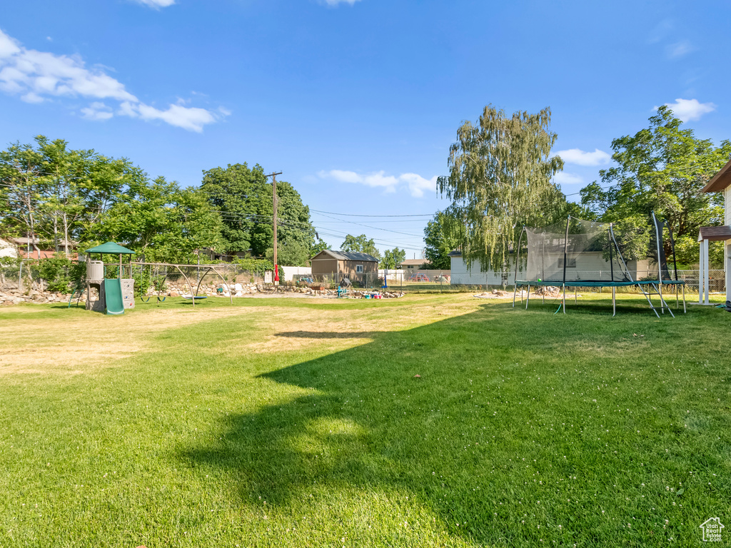 View of yard with a trampoline