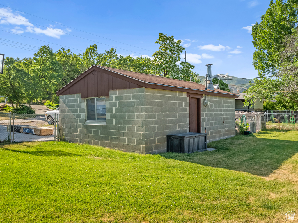 View of side of home featuring concrete block siding