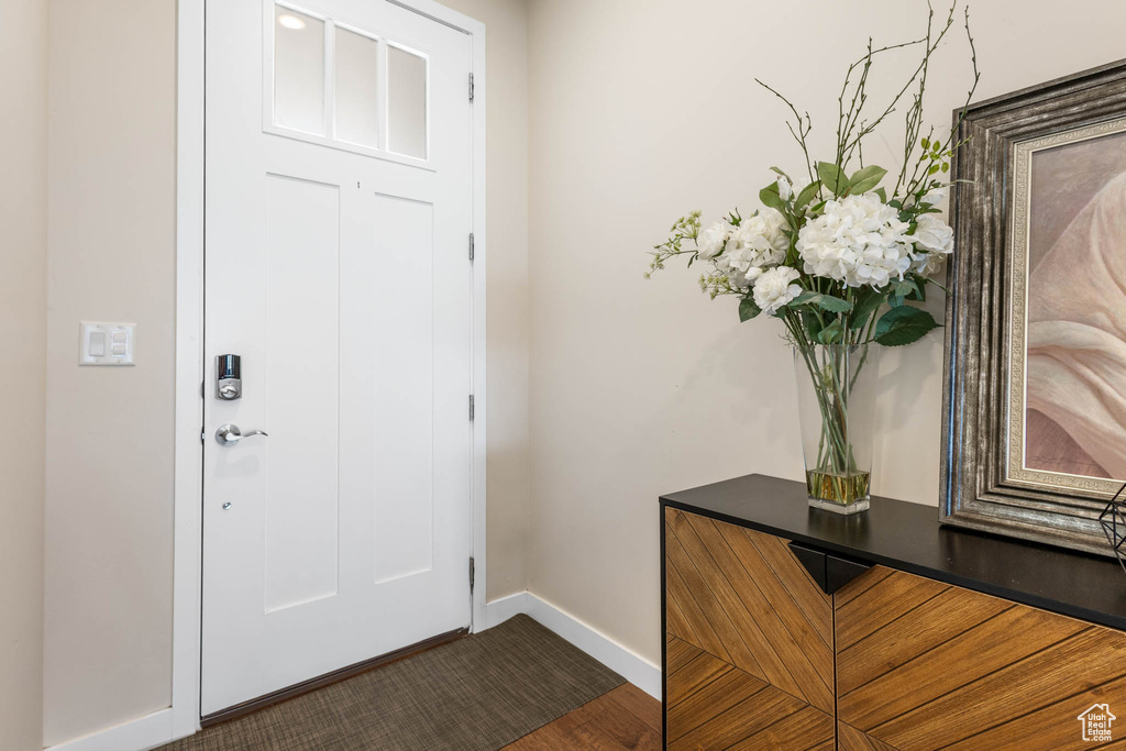 Foyer entrance featuring baseboards