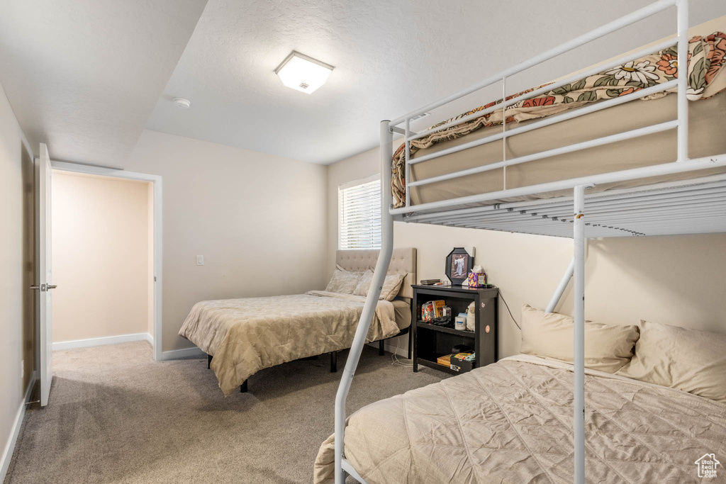 Bedroom with carpet and baseboards