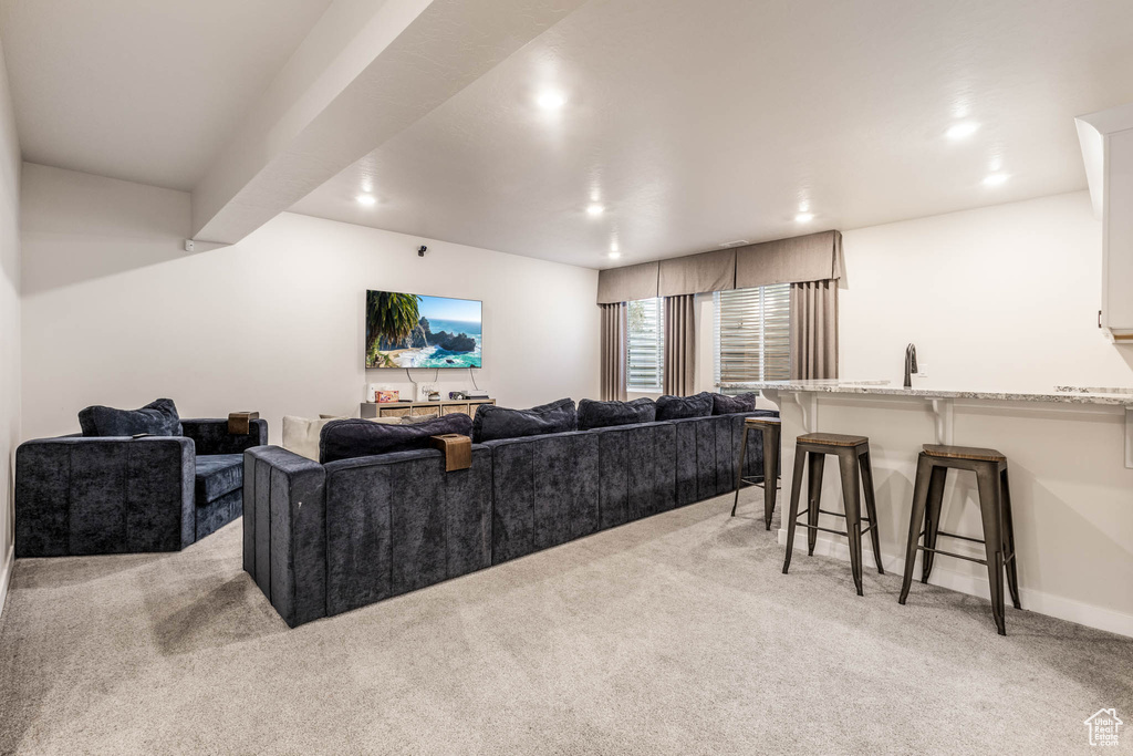 Living room featuring light carpet, recessed lighting, and baseboards