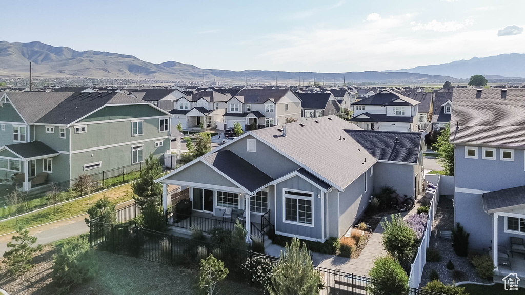 Aerial view of residential area featuring a mountainous background