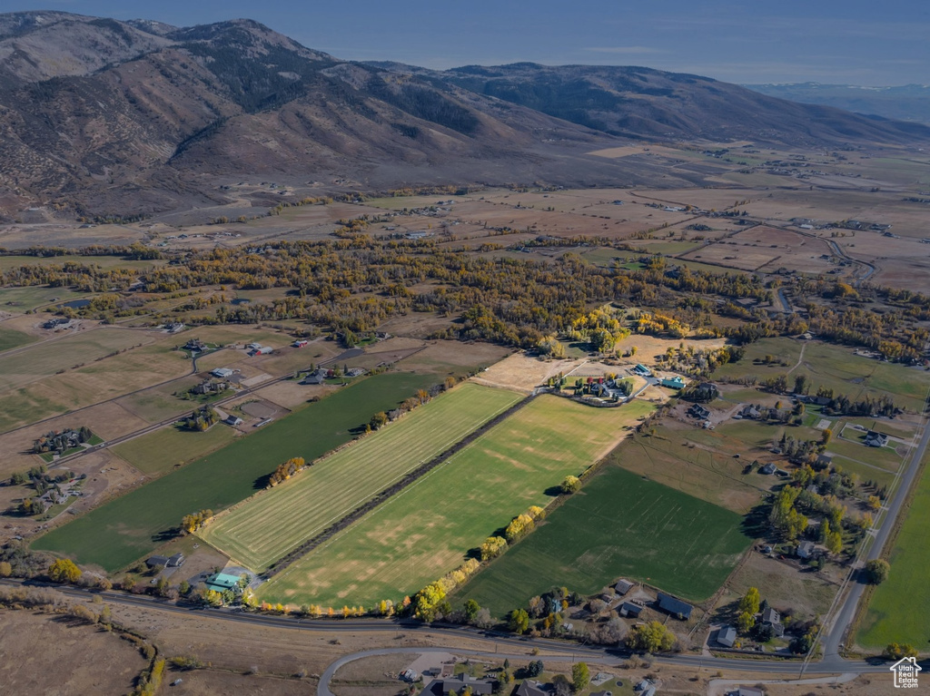 Aerial overview of property\\\'s location featuring rural landscape and a mountain backdrop