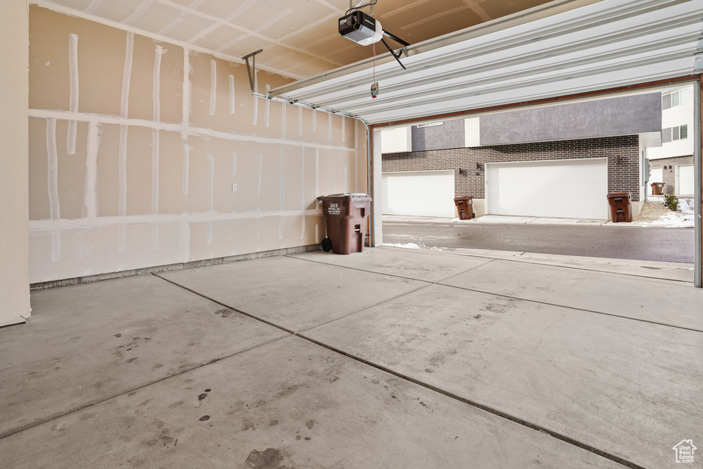 Garage featuring a garage door opener