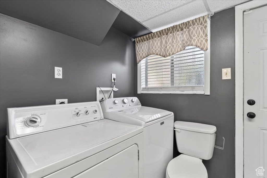 Washroom featuring independent washer and dryer