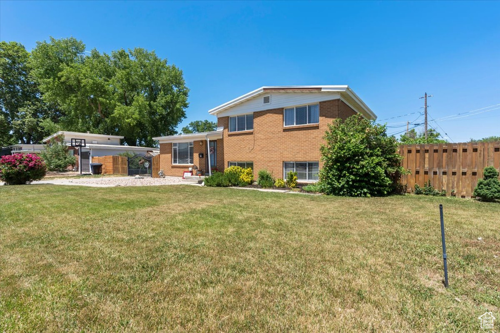 Rear view of property featuring brick siding