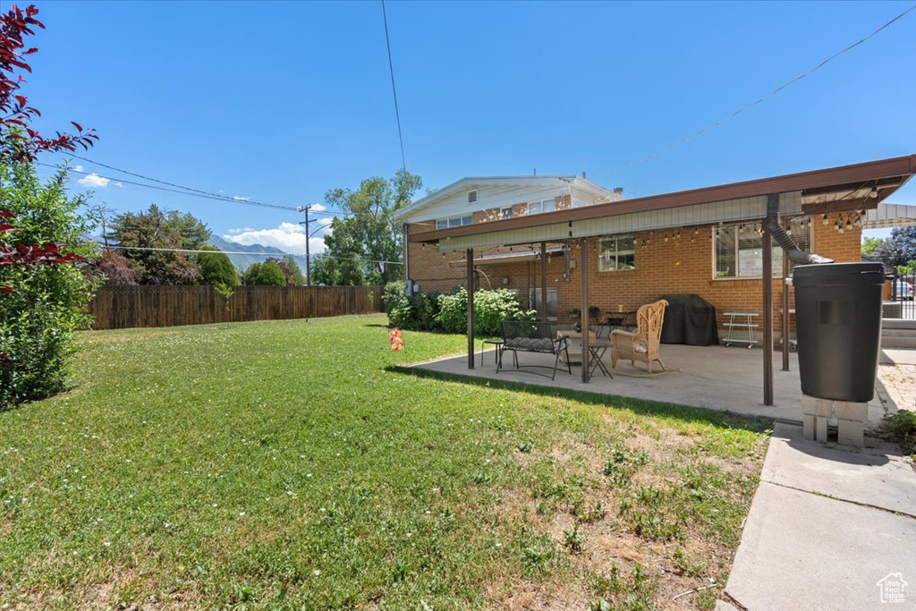 View of yard with a patio