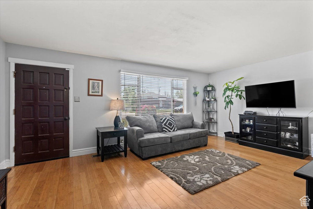 Living area featuring wood finished floors and baseboards