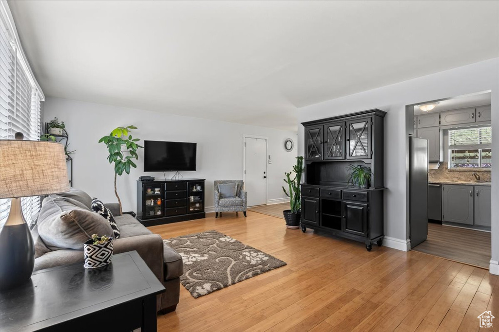 Living area with light wood-type flooring and baseboards
