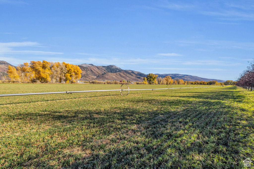 View of mountain background featuring rural landscape
