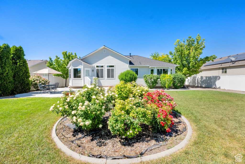 Ranch-style house with a patio