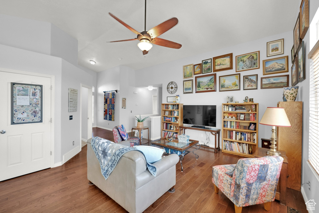 Living area with a ceiling fan and wood finished floors