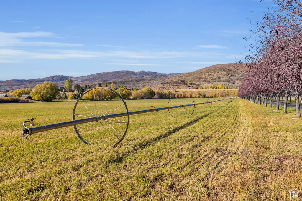 View of mountain backdrop with rural landscape