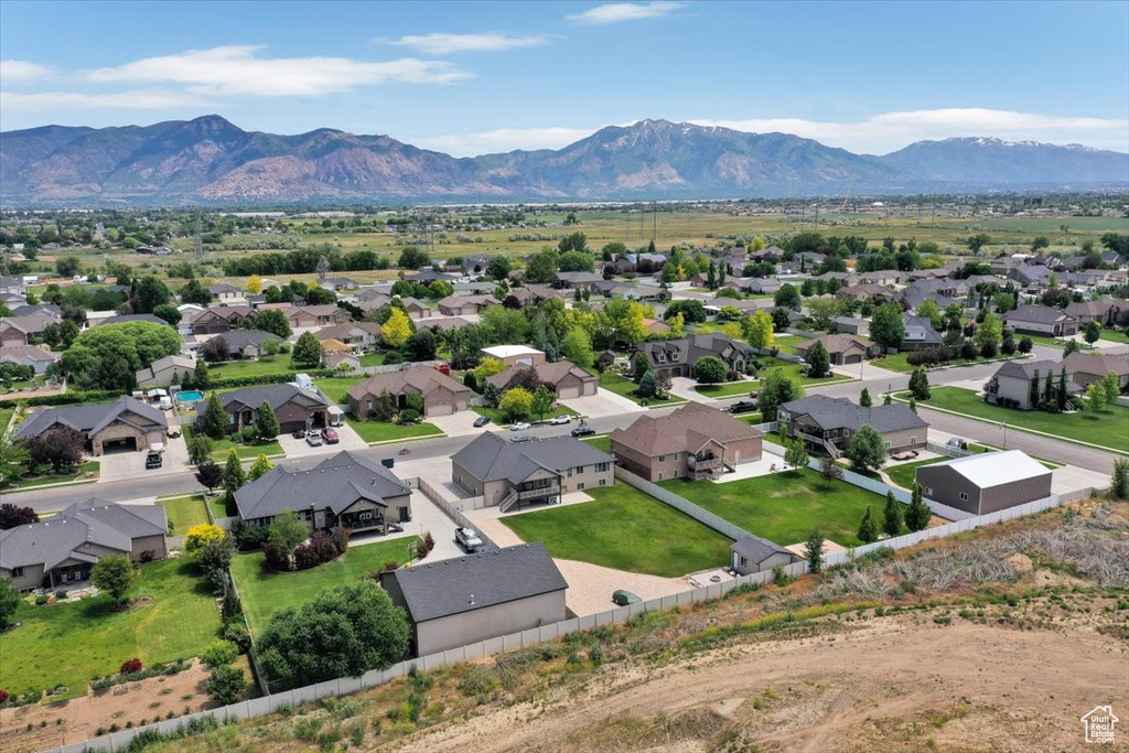 Aerial view of residential area featuring a mountain backdrop