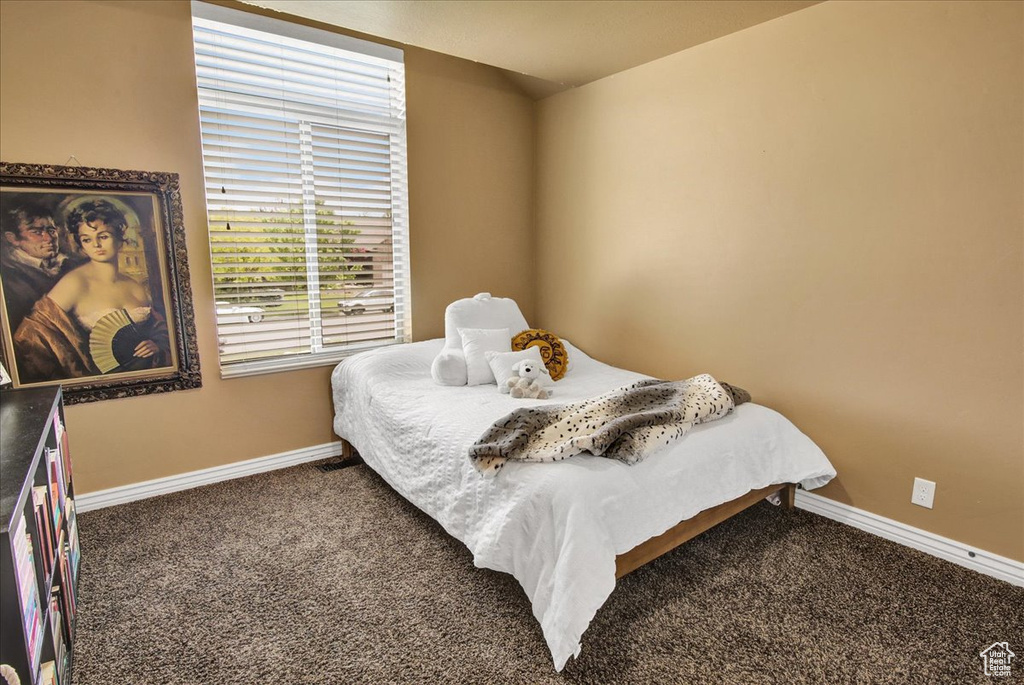 Carpeted bedroom with baseboards