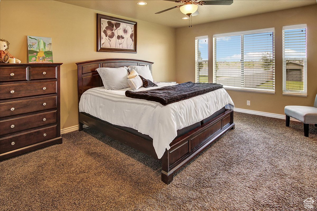Bedroom featuring dark colored carpet, baseboards, a ceiling fan, and recessed lighting