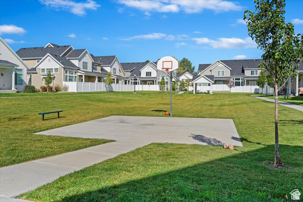 View of sport court featuring a residential view and community basketball court