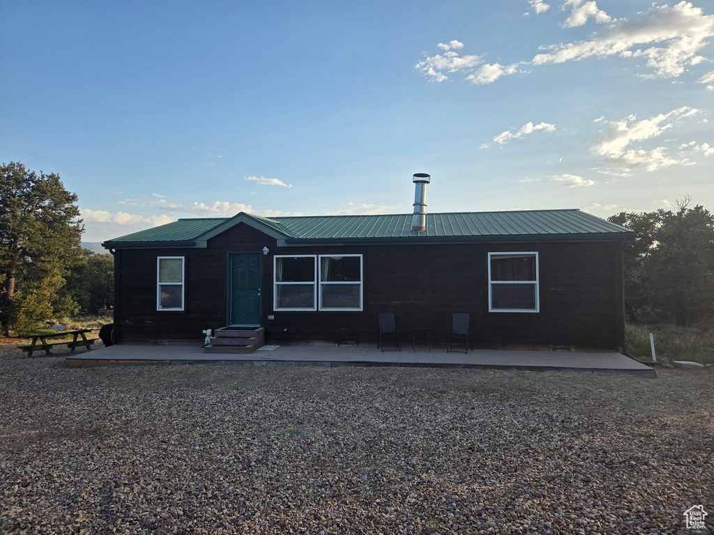 View of front of property with a metal roof