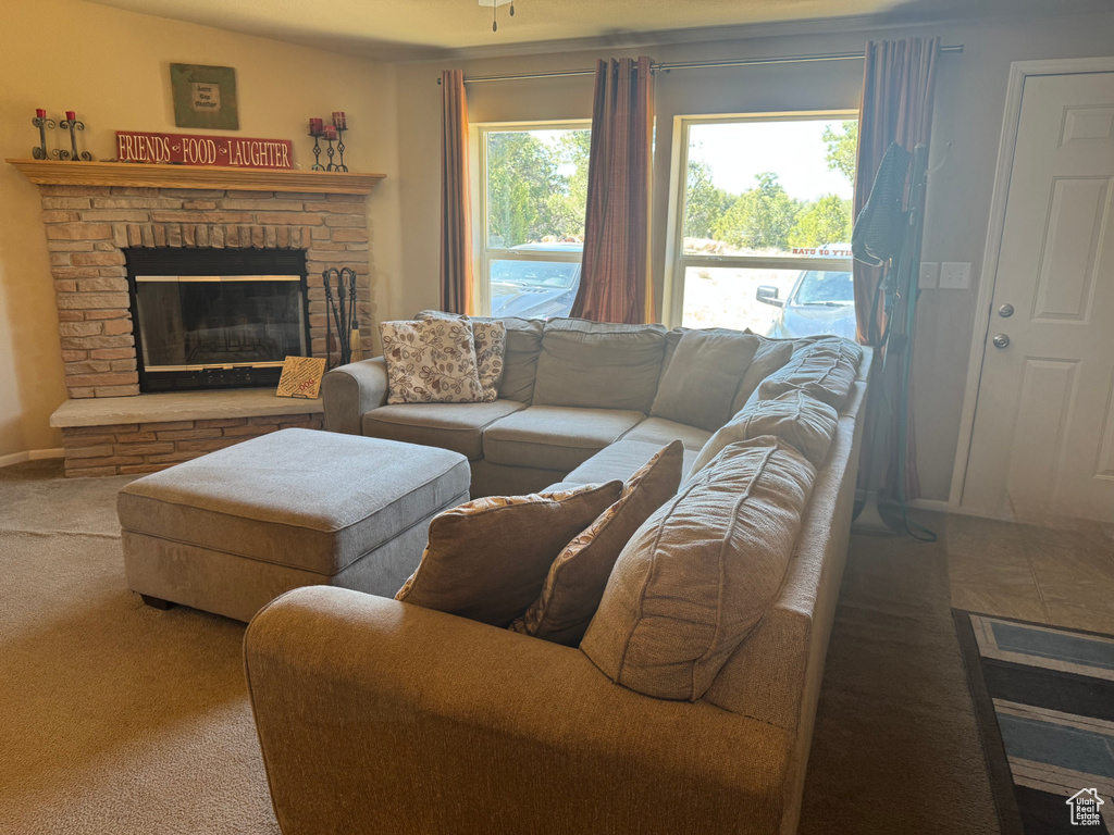 Carpeted living room with a fireplace