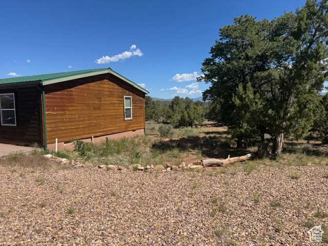 View of side of home featuring crawl space