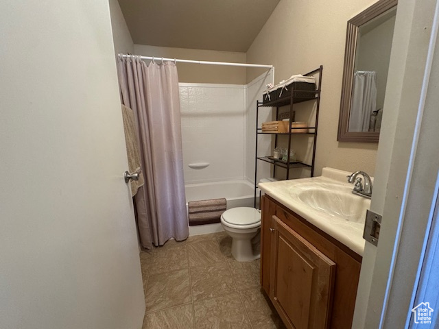 Bathroom featuring vanity and shower / bath combo