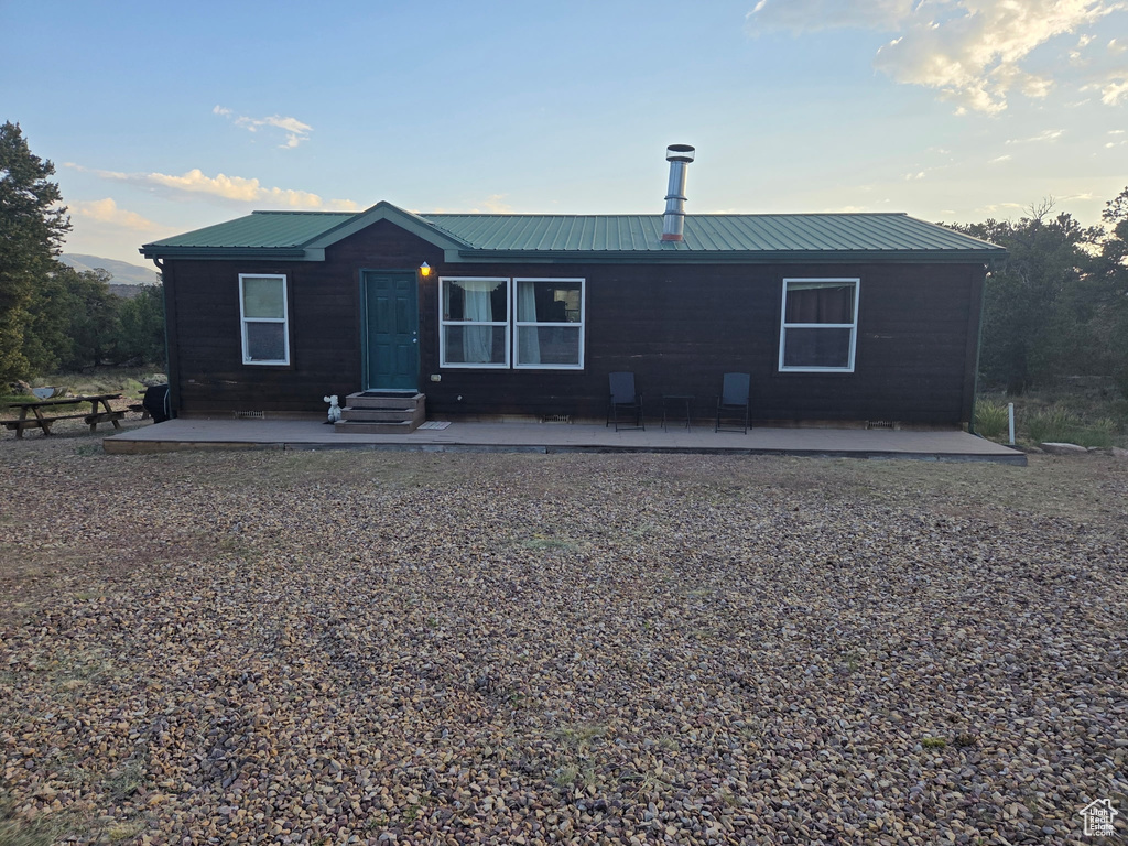 View of front of house featuring a metal roof