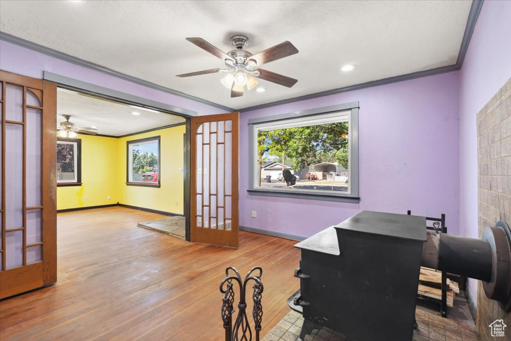Office featuring ornamental molding, a ceiling fan, wood finished floors, and recessed lighting
