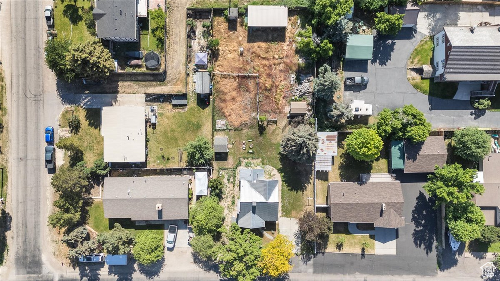 Aerial view of property's location featuring nearby suburban area
