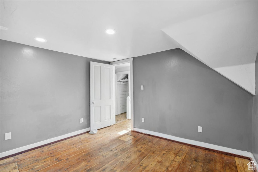 Bonus room with hardwood / wood-style floors and recessed lighting