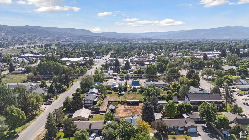 Aerial perspective of suburban area featuring a mountain backdrop