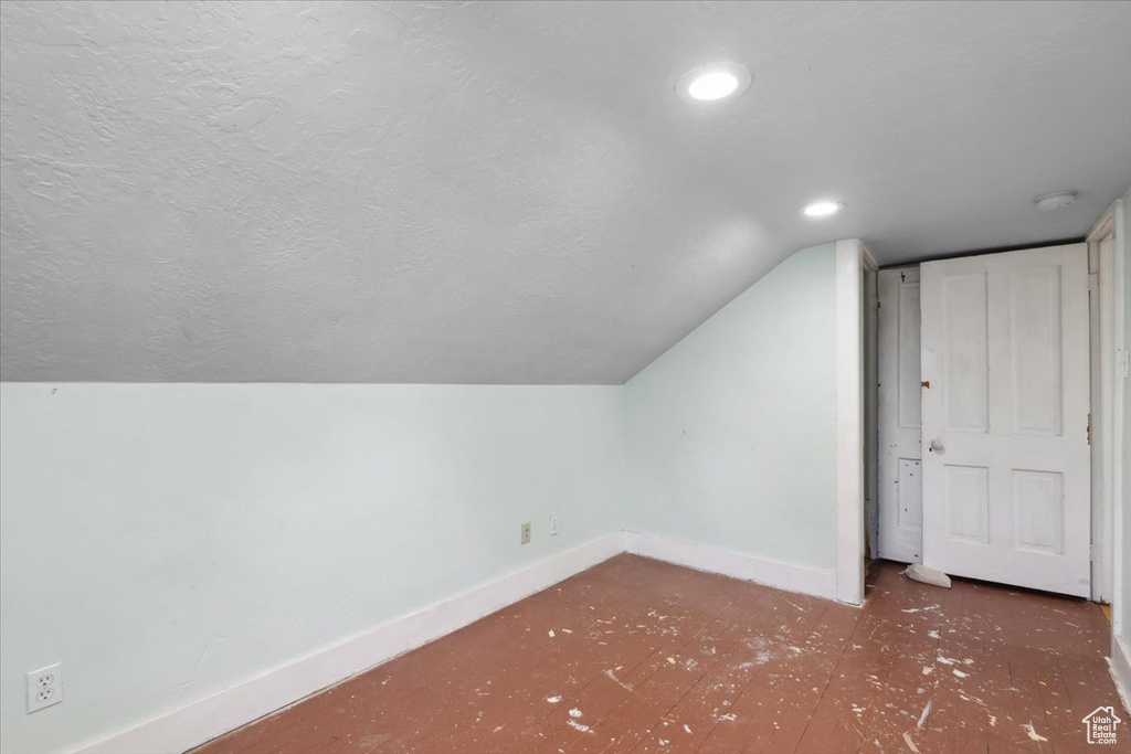 Additional living space featuring lofted ceiling, a textured ceiling, and recessed lighting
