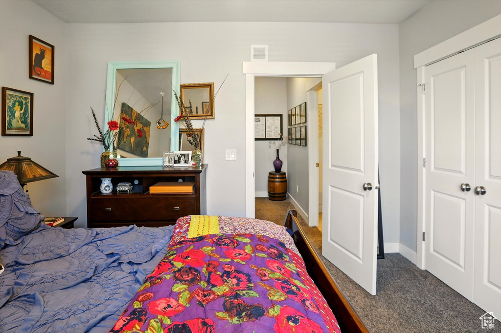 Carpeted bedroom featuring baseboards