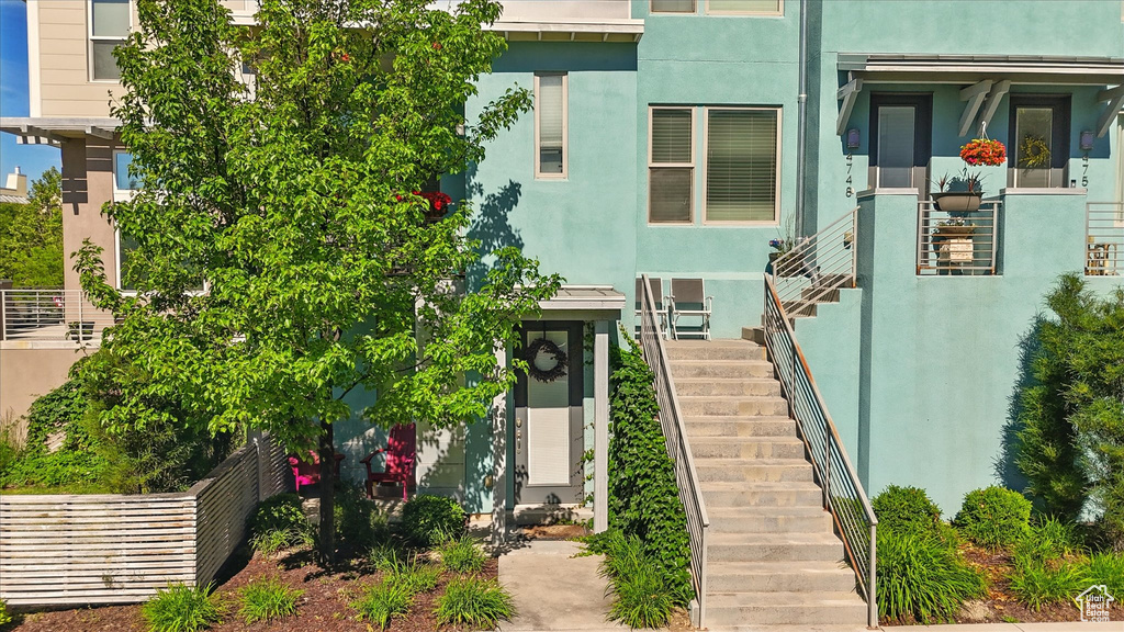 Entrance to property featuring stucco siding