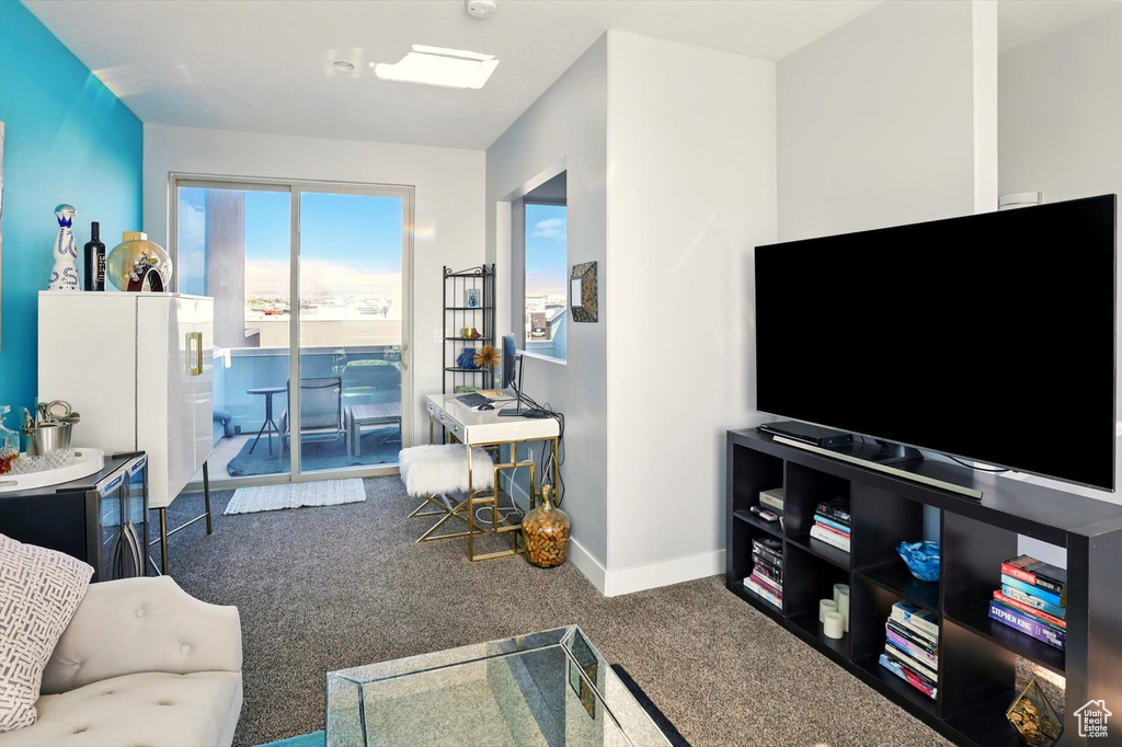 Living room with carpet and baseboards